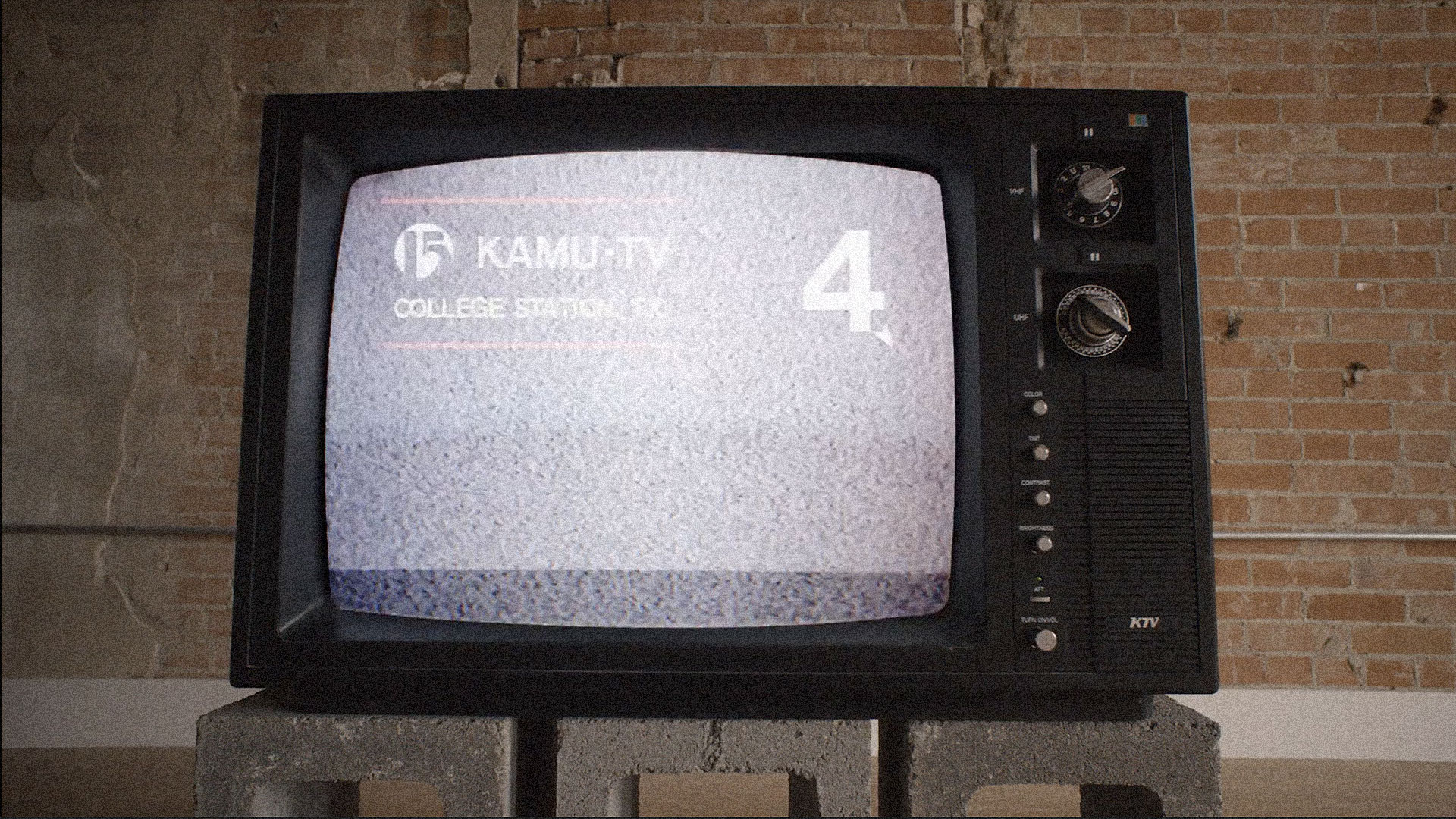 an old TV showing the KAMU-TV channel 4
