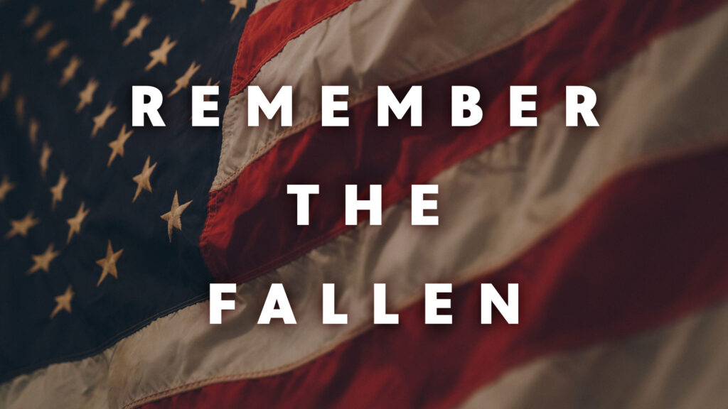 Remember the Fallen written on top of an American flag