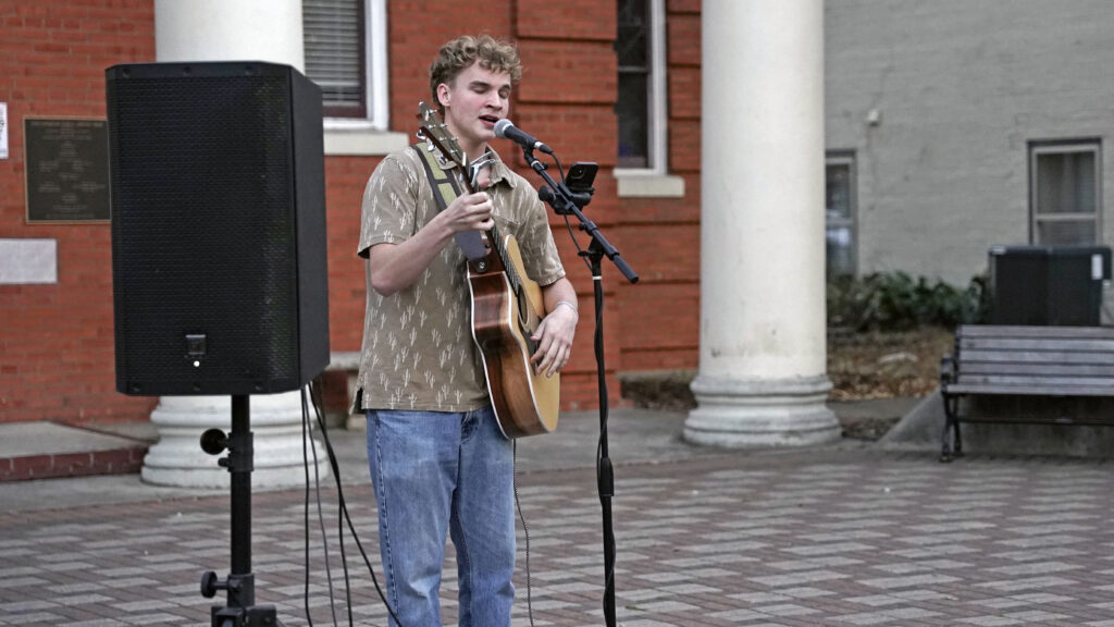 Young music artist performing