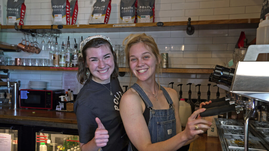 Two baristas at Polite Coffee Roasters