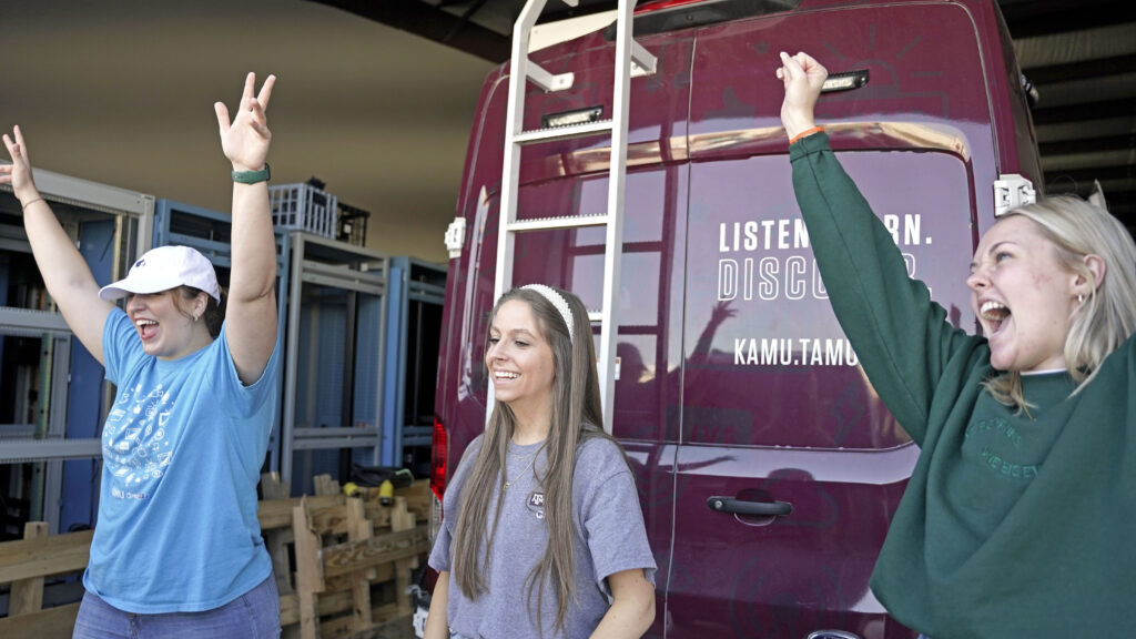 KAMU team cheering after packing up for First Friday