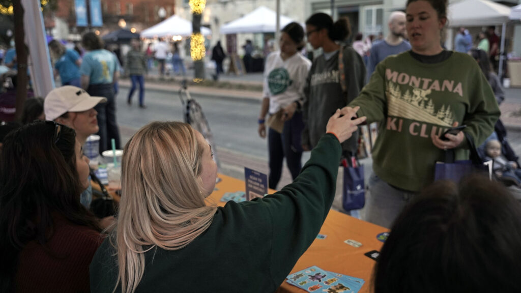 Emily giving out prize to guest