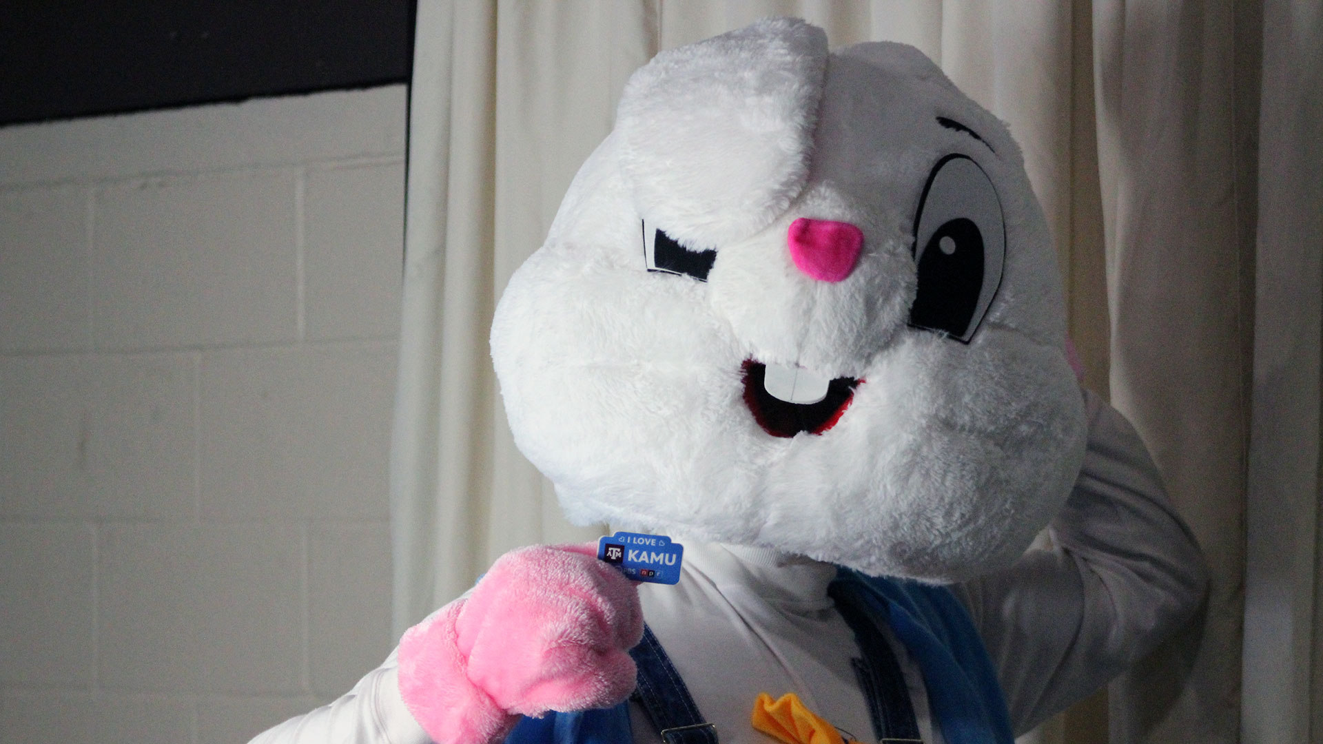 The Easter Bunny poses with an I Love KAMU sticker