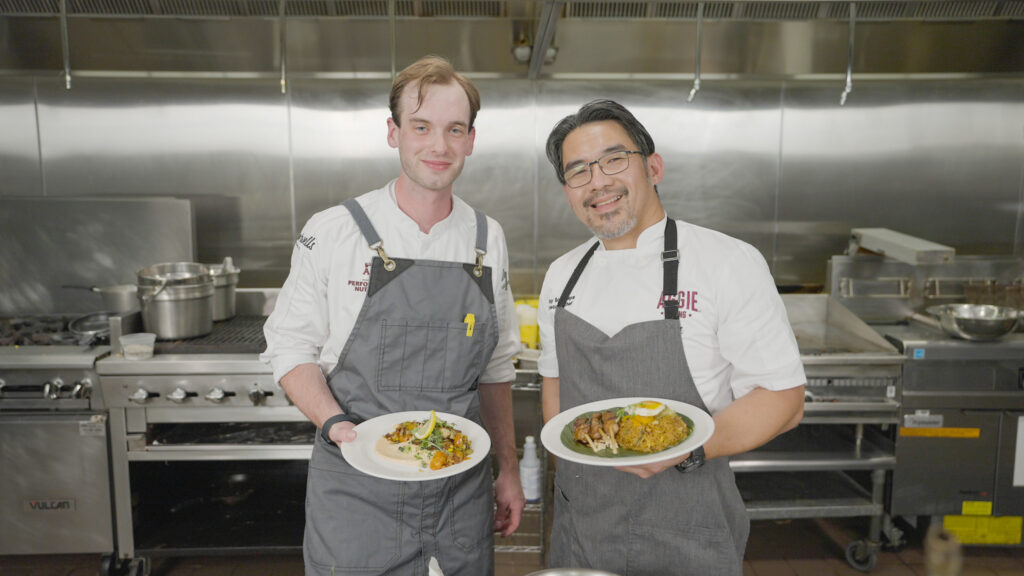 Chefs Will and Ray pose with their finished dishes.