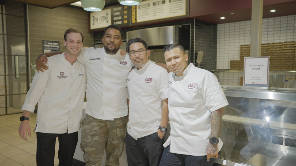 Aggie Chef Showdown chefs pose for a group photo at the end of the competition.