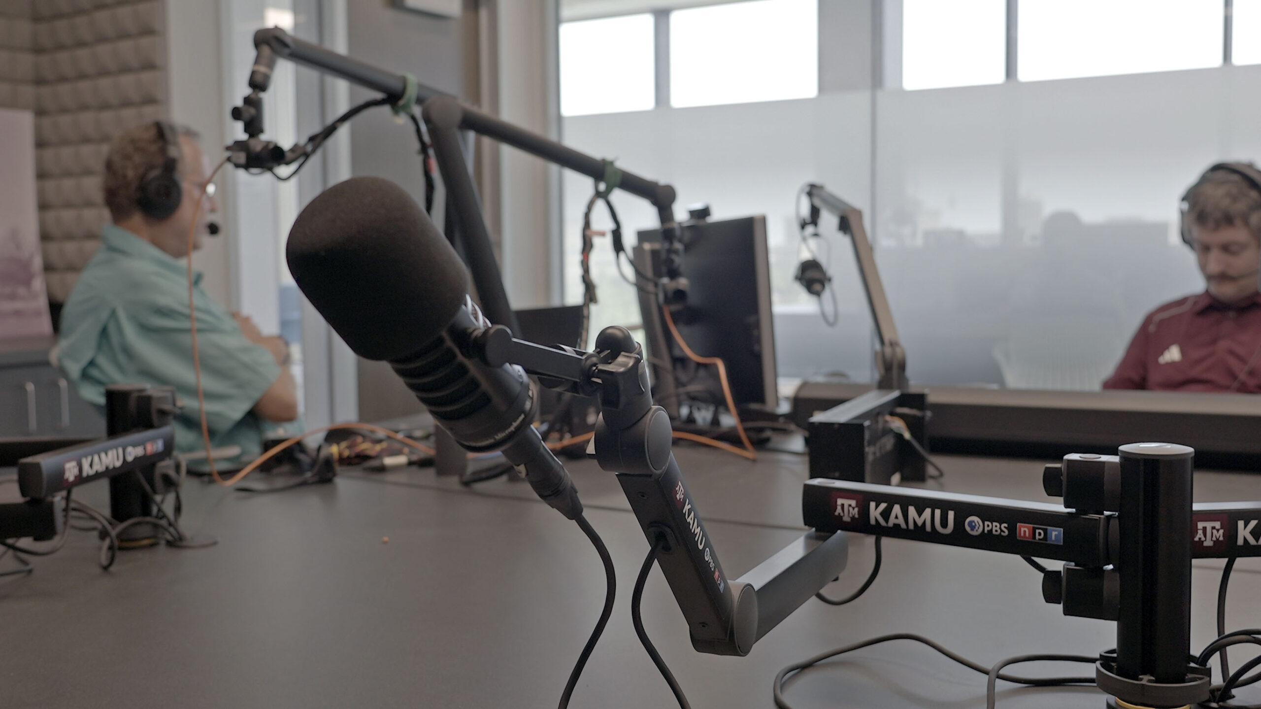 At the desk in the KAMU-FM studio