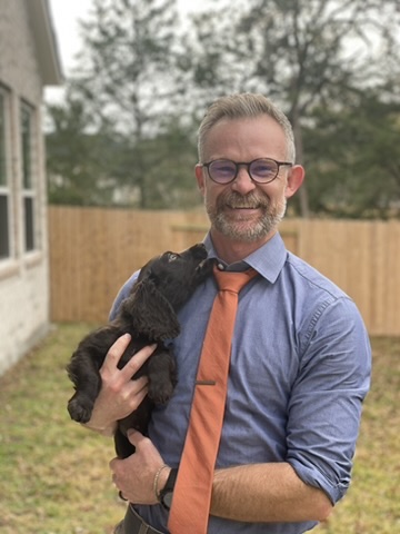 Dr. Dustin Major with his dog River