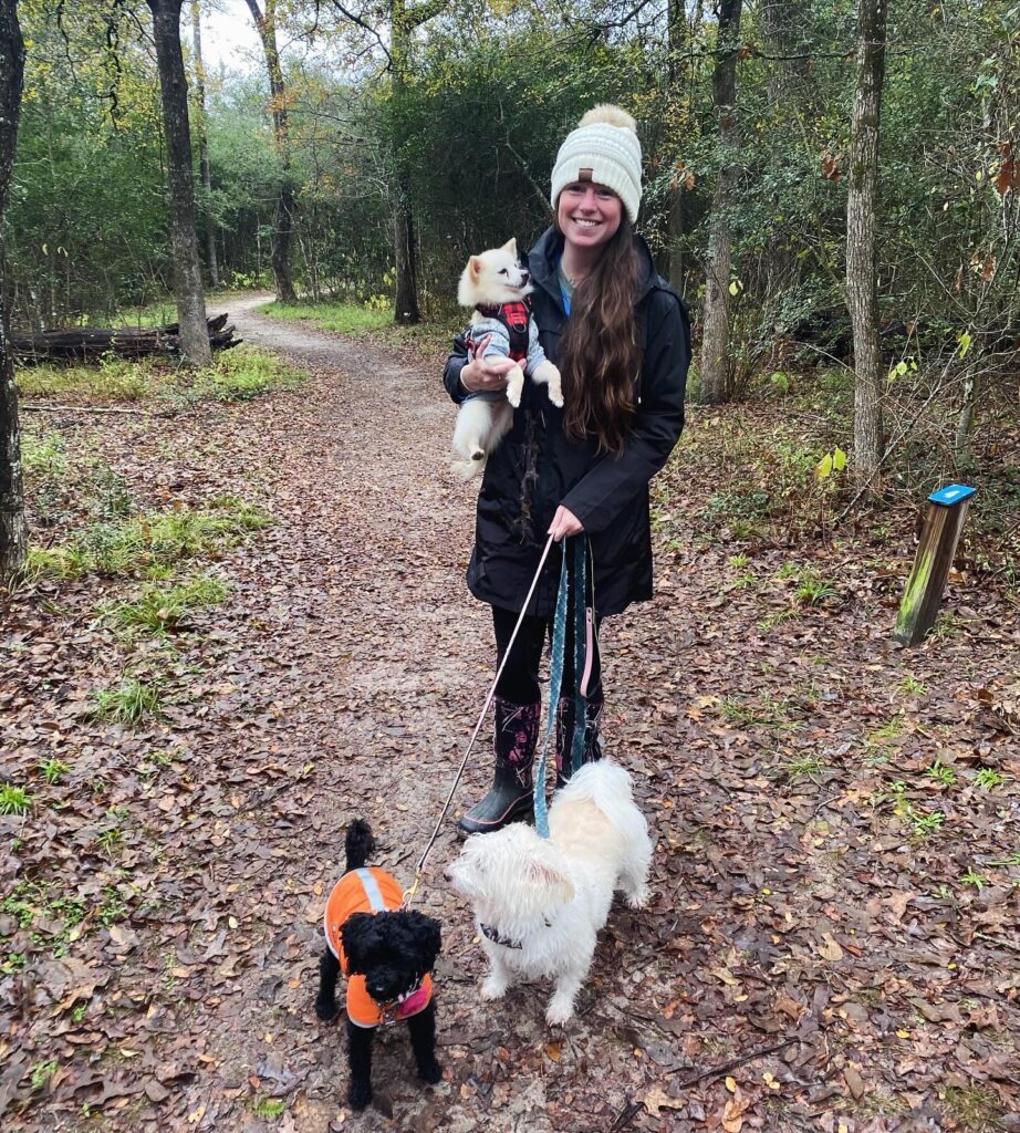 Dr. Eileen Donoghue with her dogs: Felix, a white pomeranian; Pig, a white terrier; and Poodle, a black poodle.